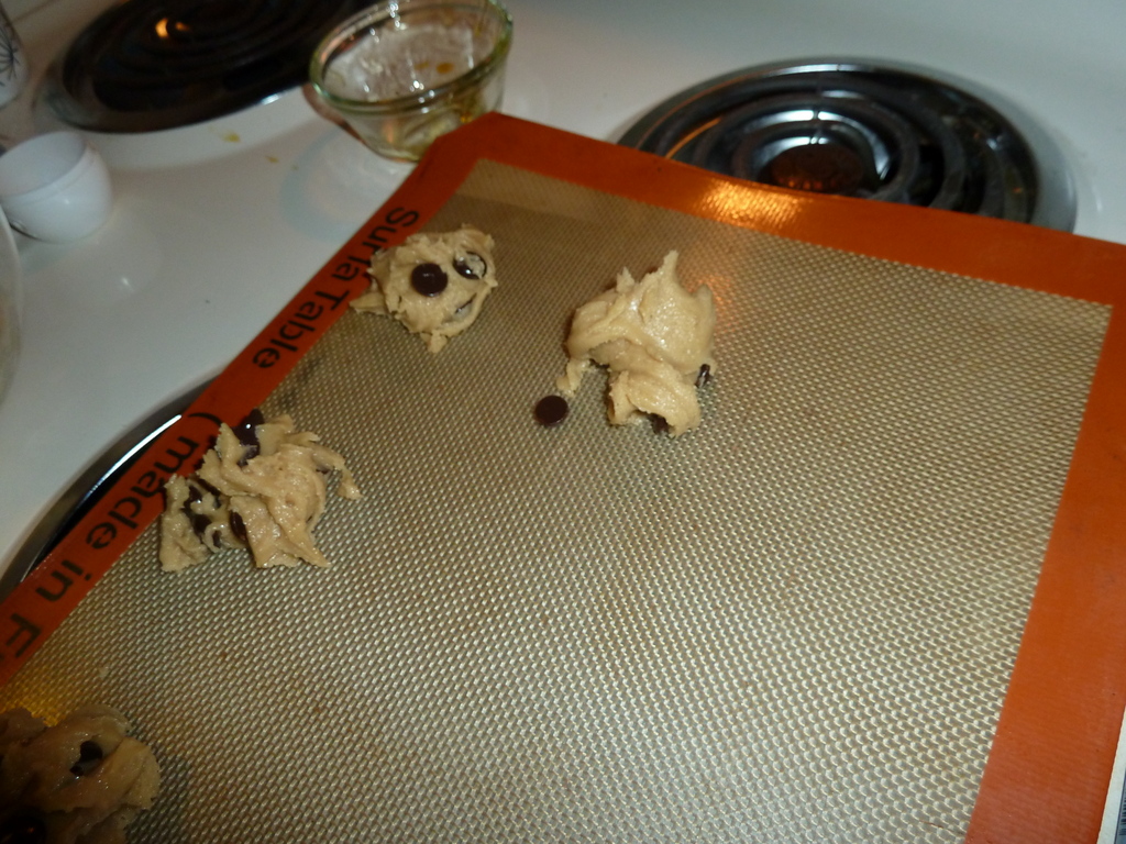 Dough is dolloped on to trays