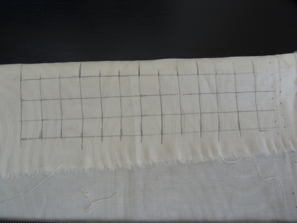 Draw grid on white fabric