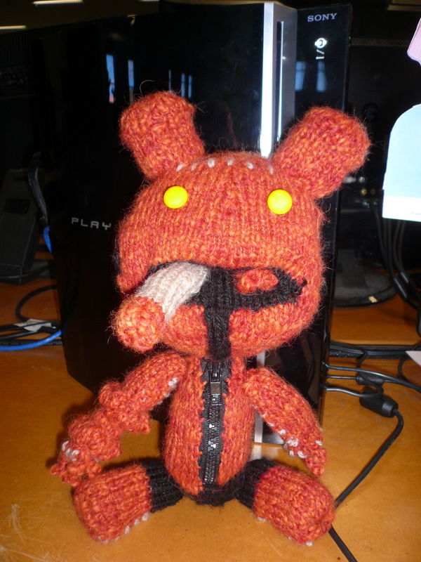 A knitted Hellboy Sackboy from Little Big Planet